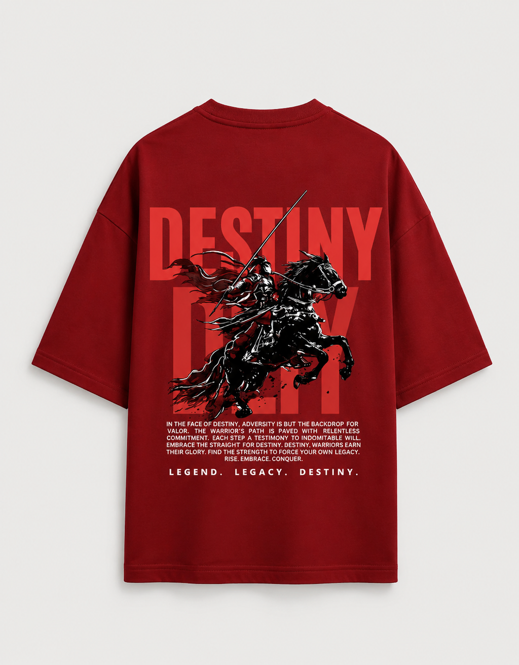 A red oversized  t-shirt shown from the back, featuring a large graphic print of a black knight on a horse with the word 'DESTINY' in bold red letters and a block of white text below.