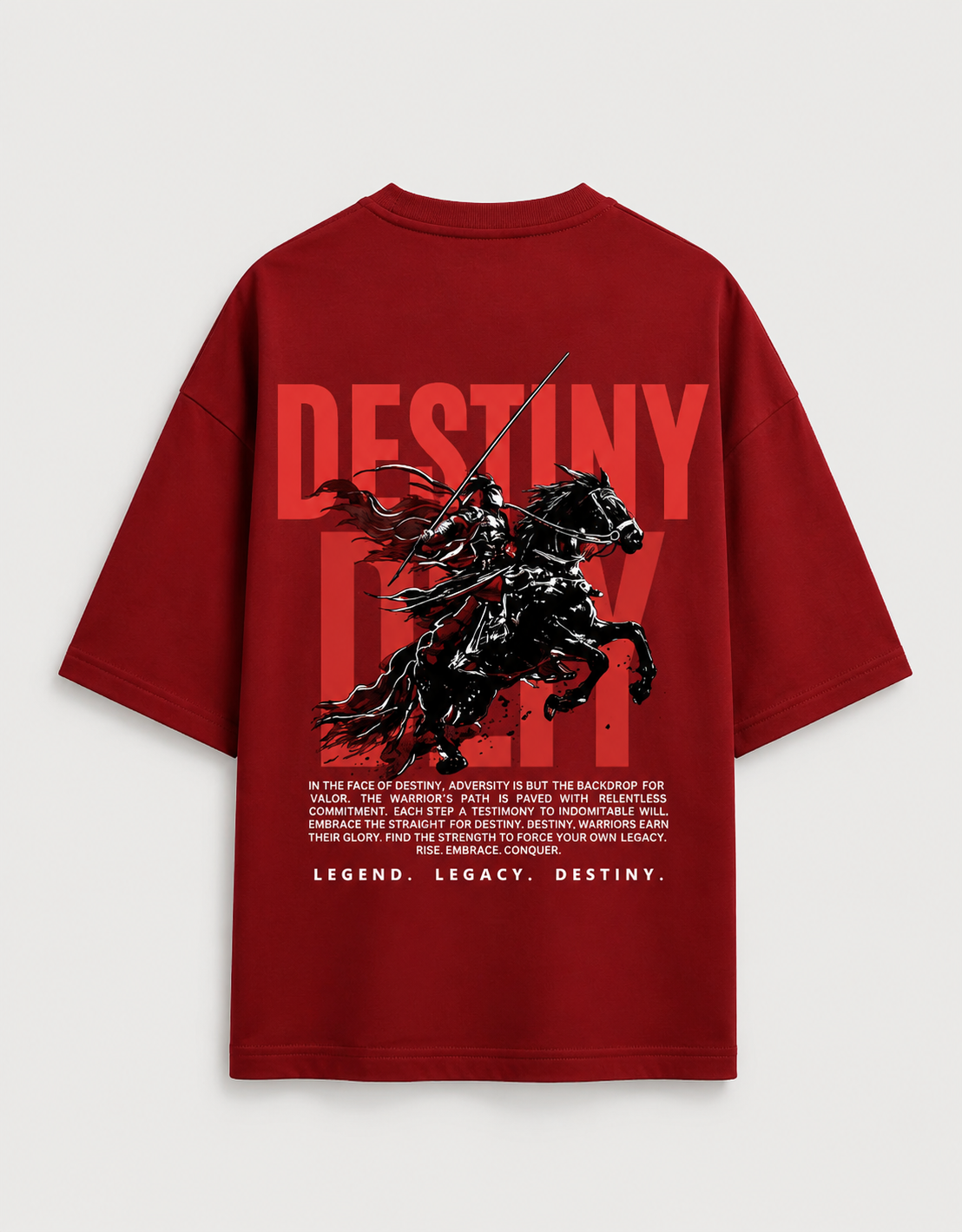A red oversized  t-shirt shown from the back, featuring a large graphic print of a black knight on a horse with the word 'DESTINY' in bold red letters and a block of white text below.