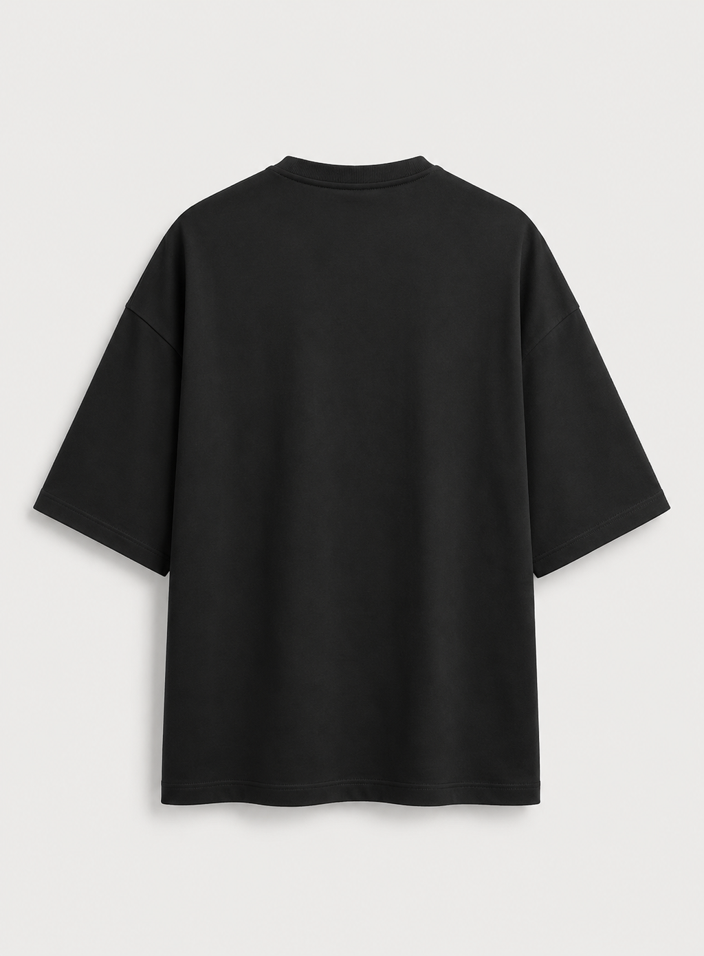 A black  t-shirt shown from the back, photographed flat against a light gray background.